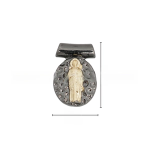 Detailed close-up of 18k gold plated religious round pendant with saint relief