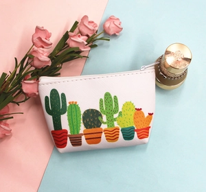 Close-up of white cactus print PU storage pouch with zipper on pink and blue background