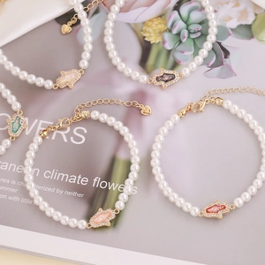 Hamsa Hand pearl bracelet with colorful enamel charms and sparkling zircon stones
