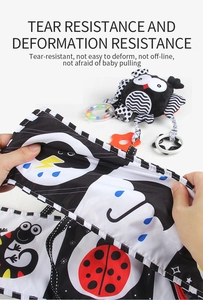 Baby cloth book showing high tear and deformation resistance with animal patterns