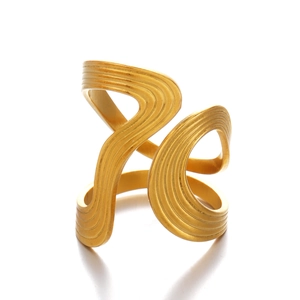 Irregular golden wavy textured bangle with a modern minimalist artistic design