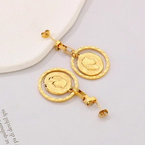 Macro detail of gold vintage coin earrings with portrait relief inside a textured ring