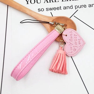Pink faux leather wrist strap with heart pendant and tassel for DIY phone cases