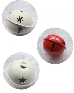Close-up of red and white 5cm Christmas bells with hollow star and snowflake patterns