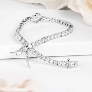 Macro detail of silver-tone copper tennis bracelet with 6mm cubic zirconia inlay