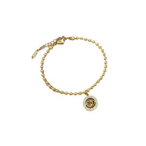Polished gold beaded stainless steel bracelet with double heart interlocked pendant charm