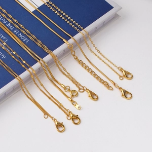 Assorted gold necklaces including snake, box, and water wave chains with lobster clasps