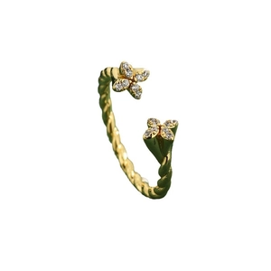 Elegant gold twisted open ring featuring delicate four-petal flower zircon accents