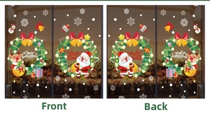 Adesivi natalizi bifacciali con Babbo Natale e ghirlande, vista fronte e retro su vetro