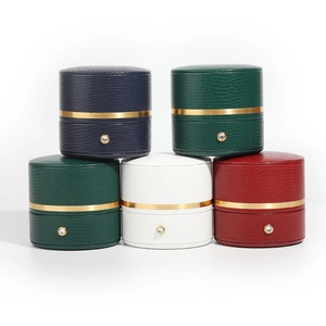 Cylindrical PU leather jewelry boxes in multi-colors with gold trim and diamond clasp