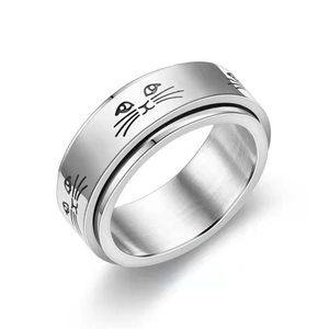Spinning stainless steel fidget ring with engraved black cat faces on a silver band