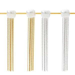 Elegant gold and silver long tassel earrings with baroque pearls in a minimalist design