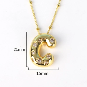 Detail showing letter C gold pendant with sparkling crystals and size measurements