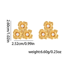 Detail view of 18k gold-plated triple flower earrings with white pearls and size markings