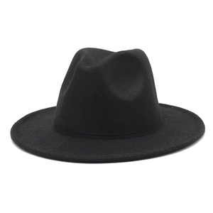 Side view of a premium black wool fedora hat with a classic dented crown and structured brim