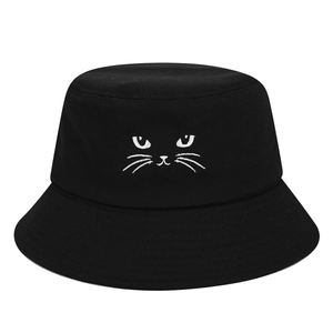 Minimalist black cotton bucket hat with cute white cat face embroidery for sun protection