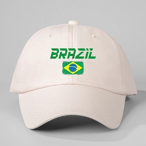 Detail of white cotton baseball cap showing Brazil text and flag print on twill fabric