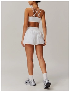 Rear view of white quick-dry yoga set showing crisscross back sports bra and shorts
