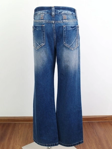 Detail of dark blue wide-leg jeans showing vintage washed effect and symmetric back pockets