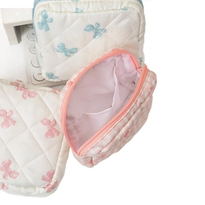 Set of quilted cotton cosmetic bags with blue pink bows and checkered patterns