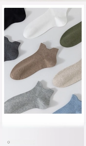 Detailed flat lay of breathable combed cotton ankle socks in various neutral earthy colors