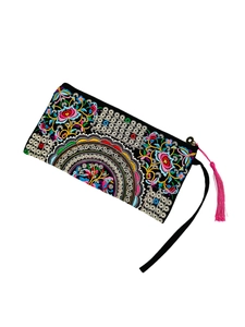 Ethnic style embroidered clutch bag with floral mandala patterns and pink tassel detail