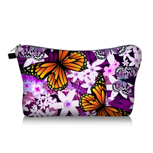 Detail of butterfly and flower print on durable travel toiletry bag with zipper
