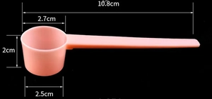 Detailed size measurement of pink long-handle powder scoop showing 10.8cm total length