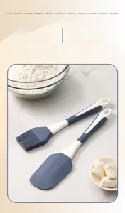 Close-up of food-grade blue silicone oil brush and spatula set with white handles