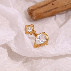 Detail of 18K gold plated stainless steel ring with asymmetric star and teardrop zircon