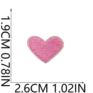 Detail showing pink heart embroidery patch dimensions 2.6cm x 1.9cm with fine needlework