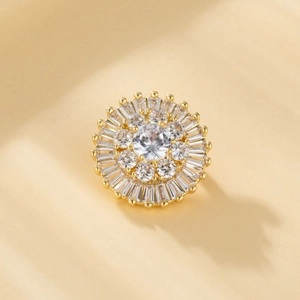 Macro view of gold-plated sunflower brooch featuring zircon clusters and sparkling inlay