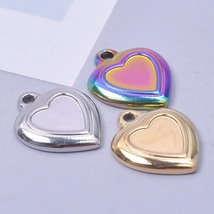 Three heart pendants in gold, silver, and iridescent 18k plated stainless steel
