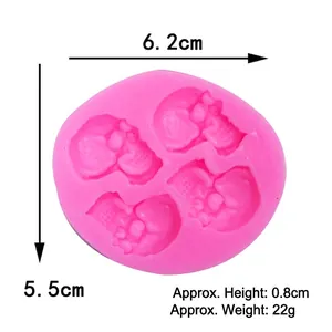 Pink silicone skull mold for Halloween cake decorating with dimension measurements