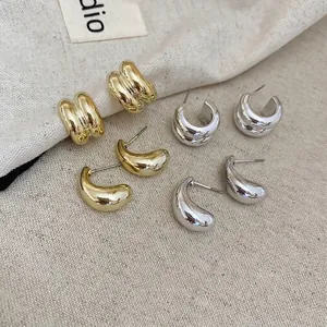 Polished gold and silver drop earrings with layered threaded C-shape hoop designs