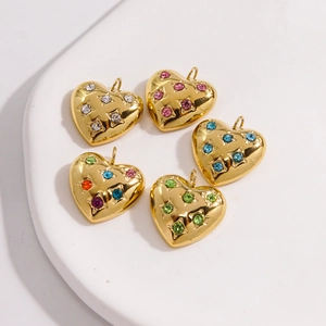 Detailed view of 14K gold plated heart charms with colorful inlaid crystals for DIY jewelry