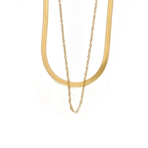 Detail of gold layered necklaces showing a sleek snake chain and a fine cross chain set