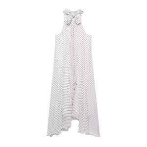 Close-up of the elegant halter neck bow and black polka dot pattern on a white dress