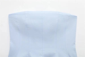 Detail shot of light blue strapless top showing premium woven texture and vertical stitching