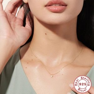 Elegant S925 sterling silver gold necklace with white opal pendant on female neck