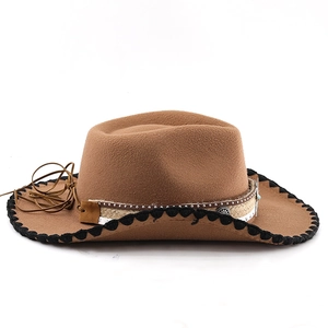 Detail of brown felt western hat with woven black edging and metal studded band