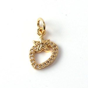 Detailed view of gold plated heart strawberry charm with micro-pave cubic zirconia