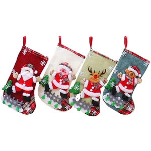 Four Christmas stockings with 3D Santa, Snowman, Reindeer, and Bear on white background