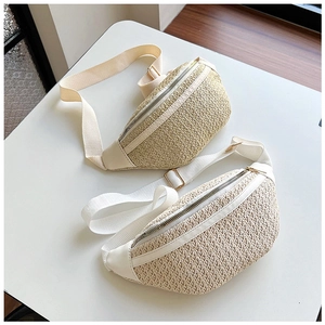 Detail of woven straw waist bags with white PU trim and adjustable textile shoulder straps