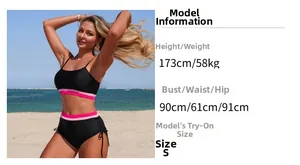 Detail of high-waisted black bikini with pink striped trim and side drawstring design