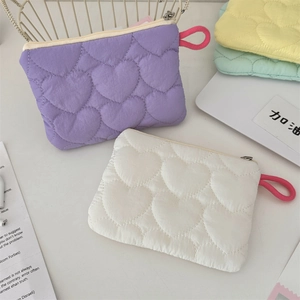 Quilted heart candy-colored sanitary bags in purple, white, yellow, and mint green