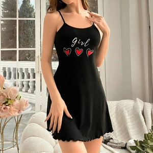 Detail of black mini nightdress featuring white Girl print and lettuce hem finishing