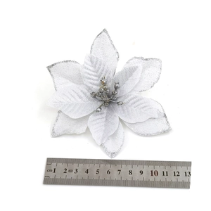 Detailed view of silver glitter Christmas flower decoration showing 13cm size measurement