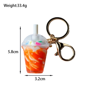 Miniature orange sundae keychain detail showing dimensions of 5.8cm height and 33.4g weight