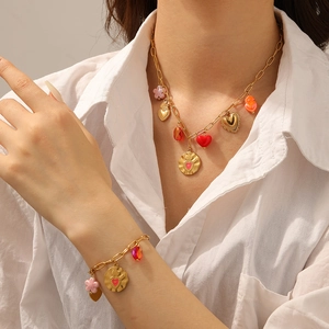 Elegant 18K gold plated stainless steel jewelry set with red heart and floral charms
